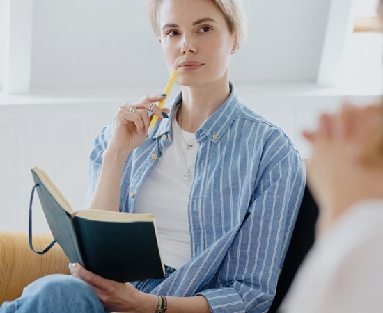 psychologist holding a pen