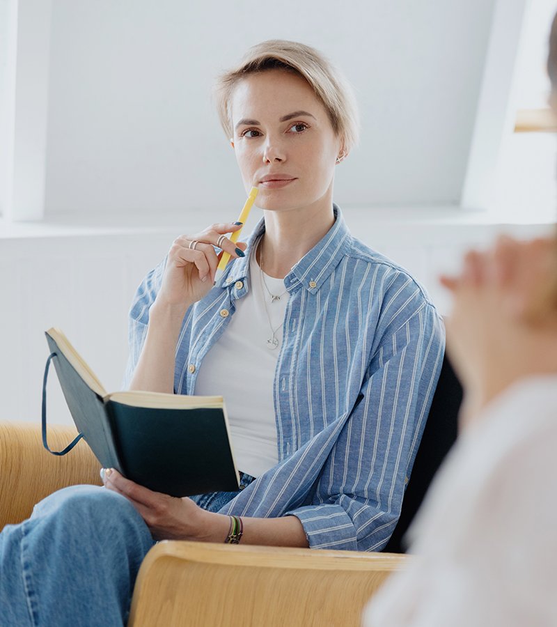 psychologist holding a pen